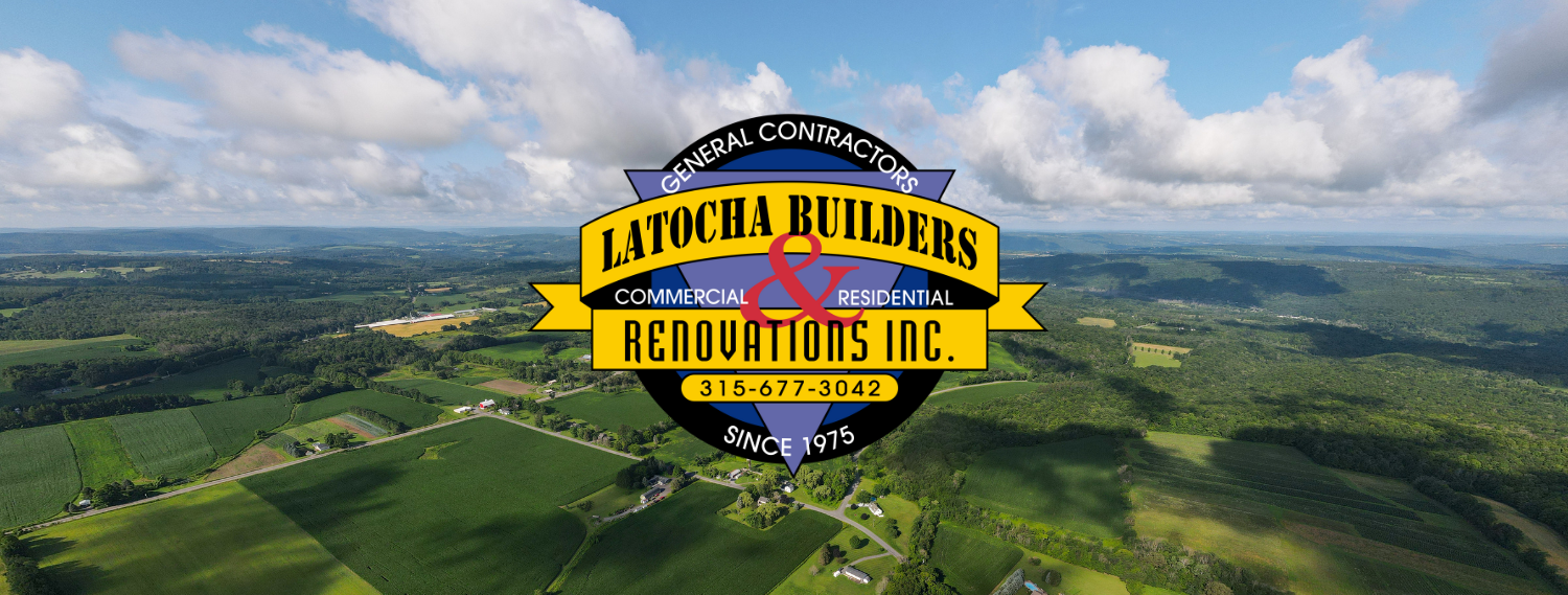 The Latocha Builders Logo over a lot of land